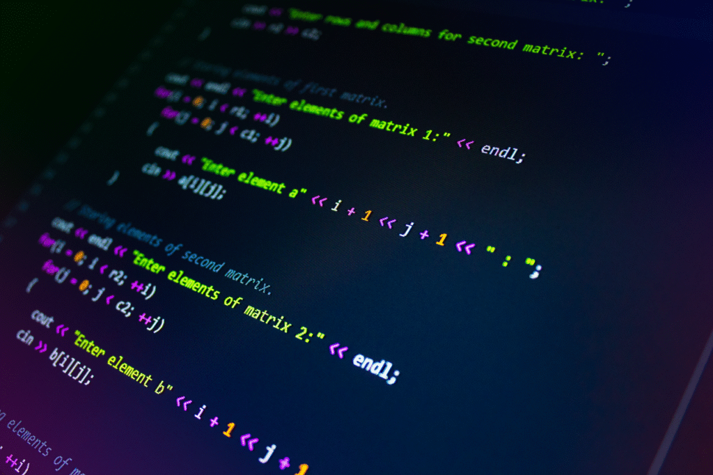 pexels photo 1102797 Close-up of colorful programming code displayed on a monitor screen.