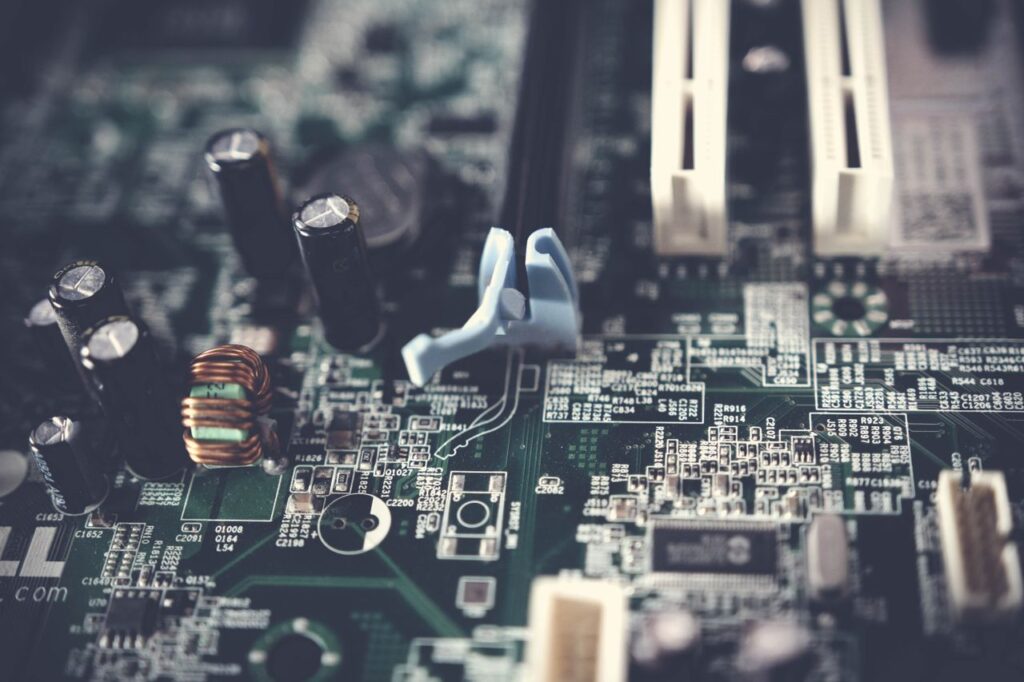 pexels photo 1432794 Detailed view of components on a computer motherboard, showcasing technology and circuitry.