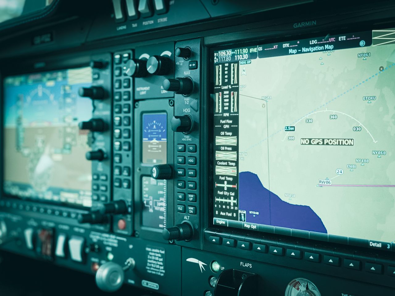 About Detailed view of a modern aircraft cockpit display panel showcasing navigation systems and controls.