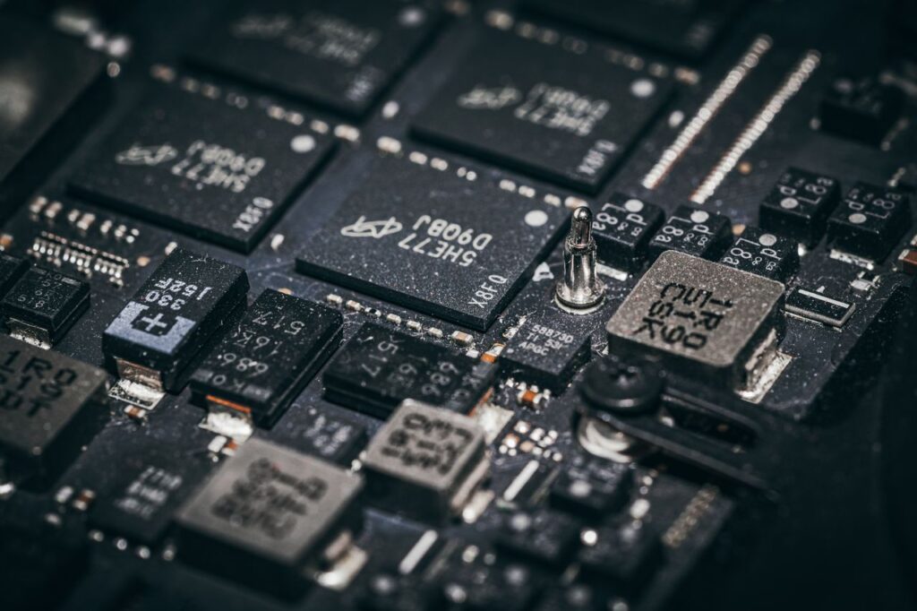pexels photo 36169774 Detailed close-up of electronic microchips on a circuit board, showcasing technology and engineering intricacies.