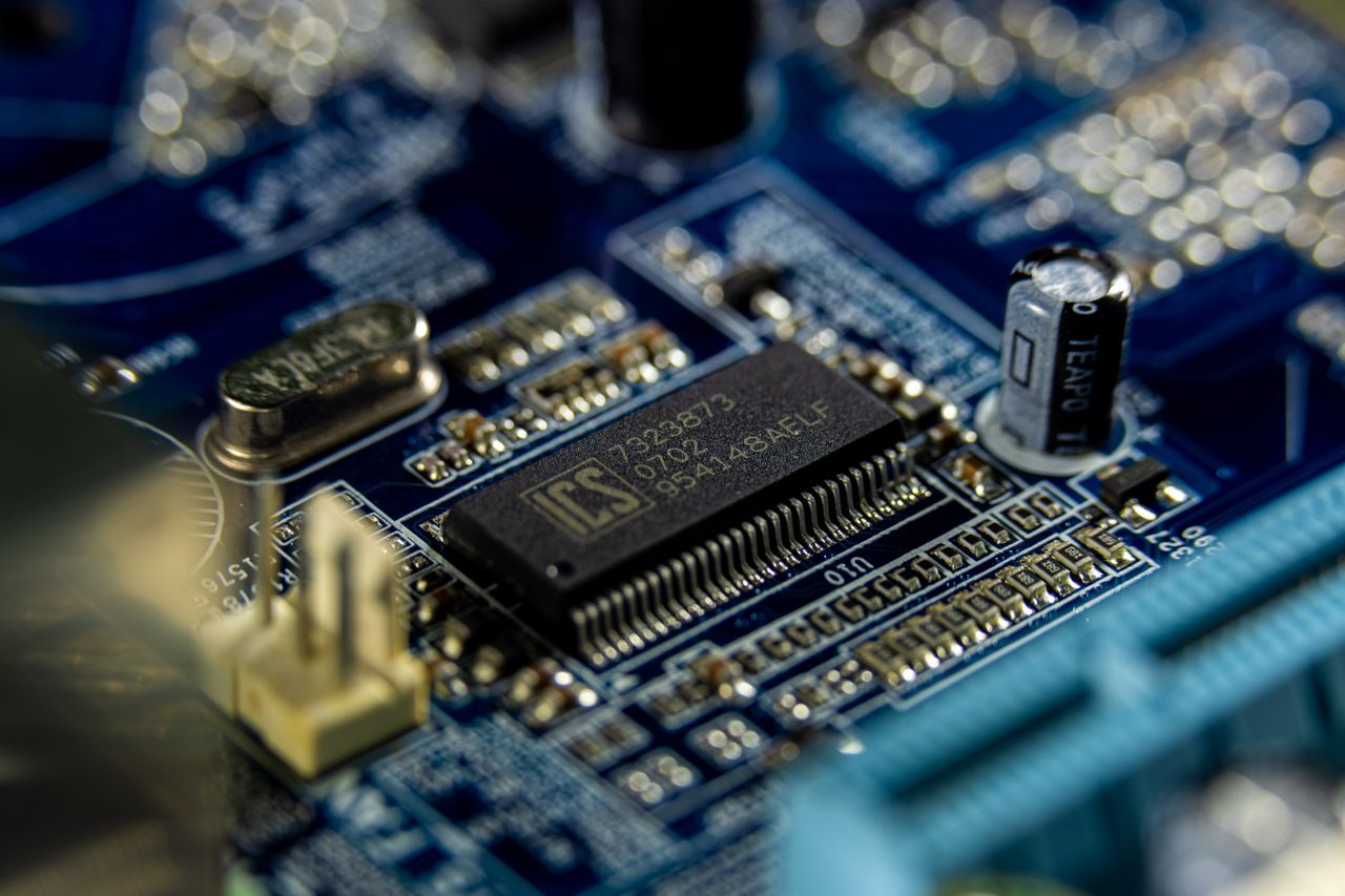 About Detailed shot of a microprocessor on a blue motherboard showcasing electronic components.
